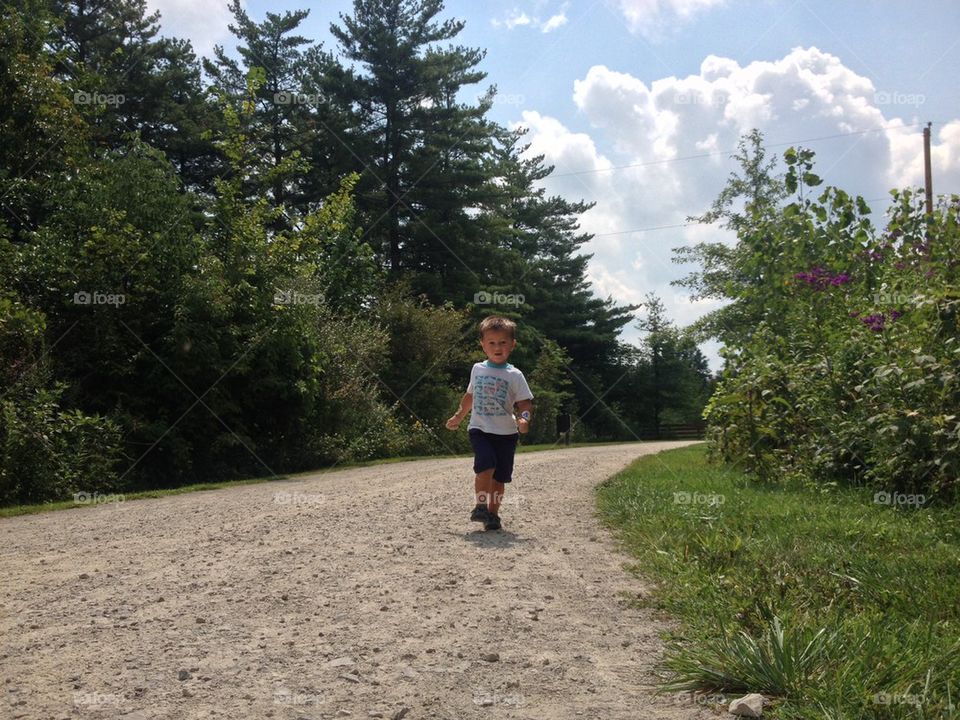 Child running on pathway