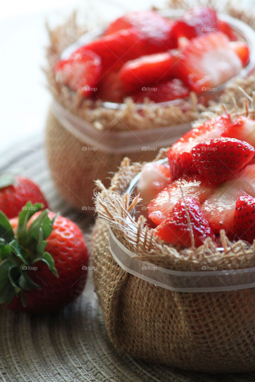 Two bowls of strawberries