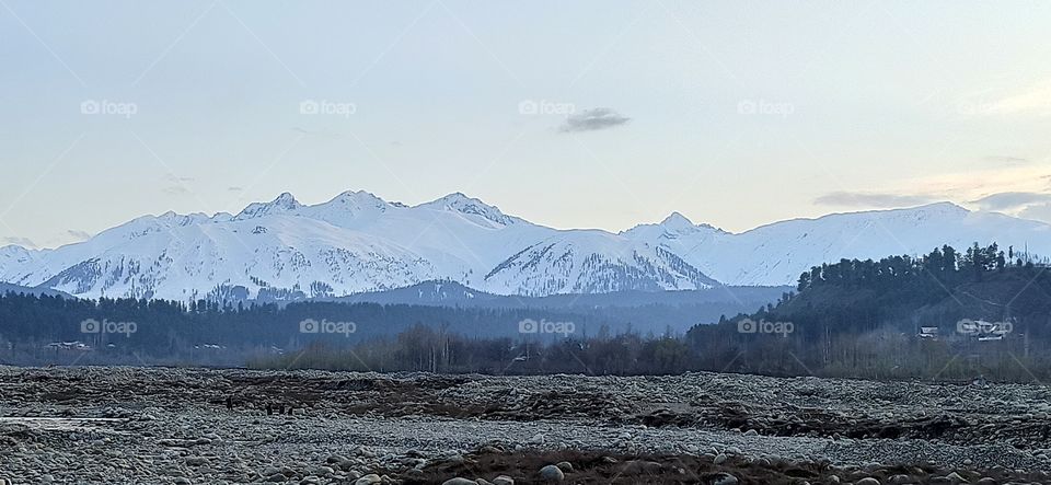 Snow Clad Mountains (during sun set time) along Pir Pangal Range  Of Hirpora Shopian along Historic Mughal Road Shopian Snap taken at Rambi Sarah Nallah banks in Apple town ( Shopian ) Kashmir J&K.