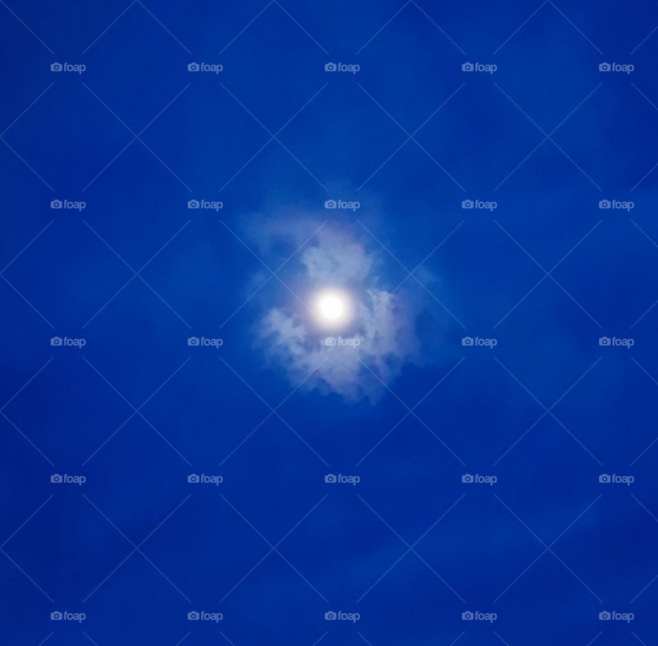 moon between clouds,cloudy,clouds,moon,blue,sky,shining,evening,night,nature,landscape,colorful