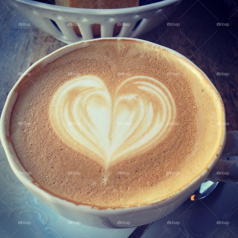 Coffee cup with a beautiful cappuccino foam heart ,perfect cappuccino,by Lika Ramati art