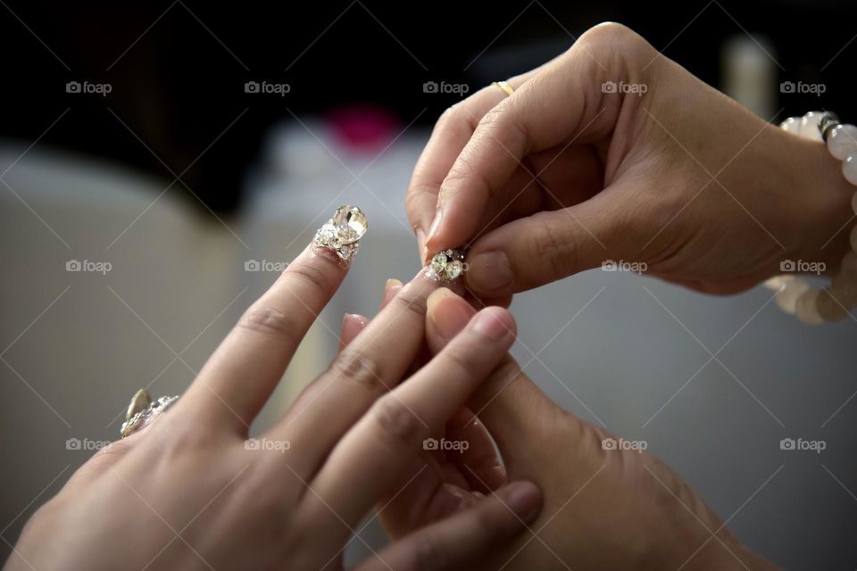 The main function of nails is to protect the fingertips which are soft and full of nerves, and enhance touch.  Nails are not part of the bone but are made of a protein called keratin.  Keratin is not only found in nails, but also in skin and hair.