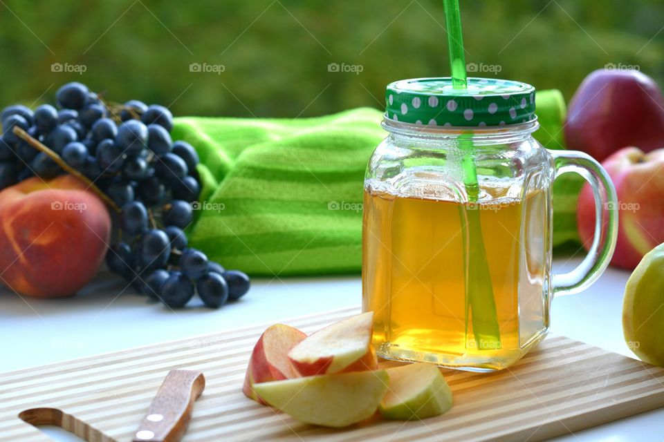 fruits juice and fruits green summer background