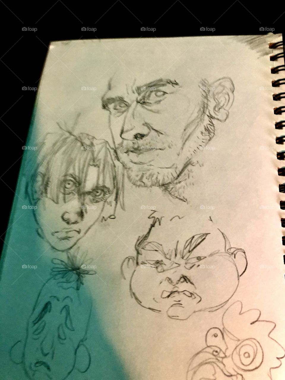 A page from a sketch book with pencil drawings 