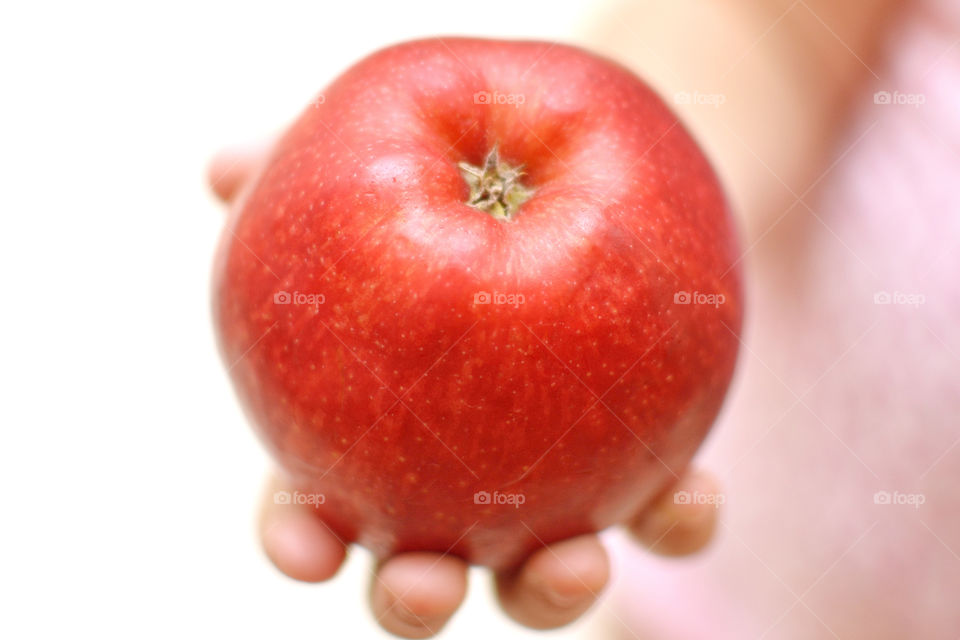 red apple in child hand