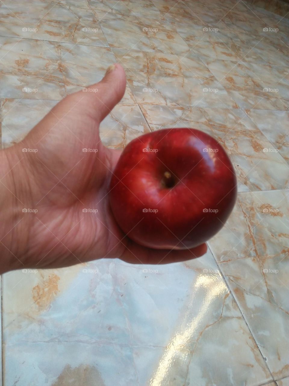 Im holding red apple.