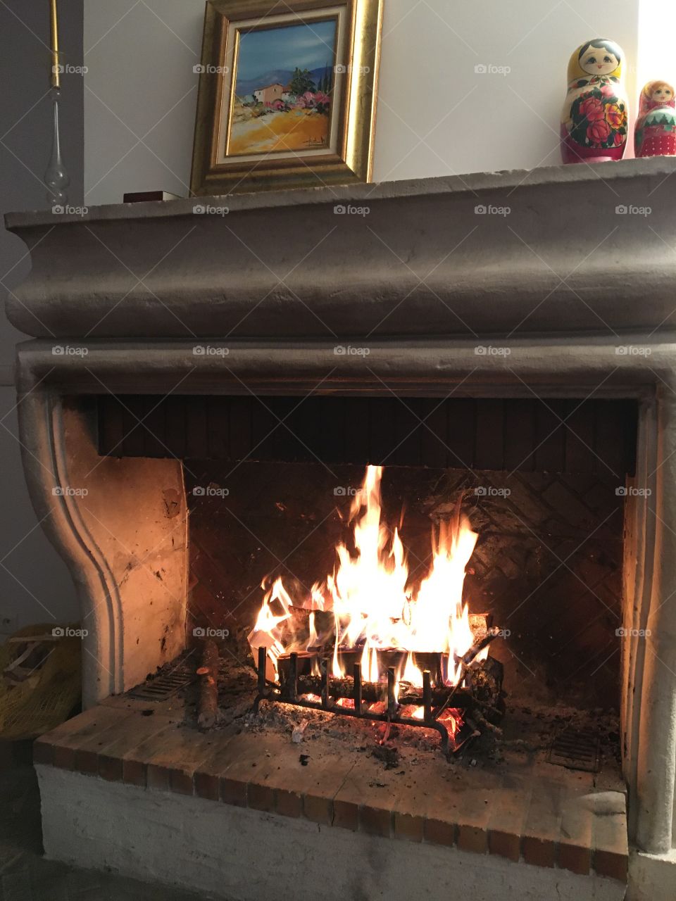 Staying near the fireplace 