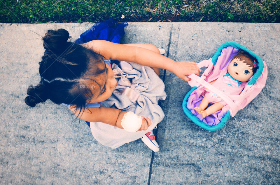 Kid with baby eating ice scream