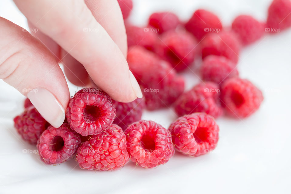 Sweet fresh raspberries, ready to eat. Moods of summer.