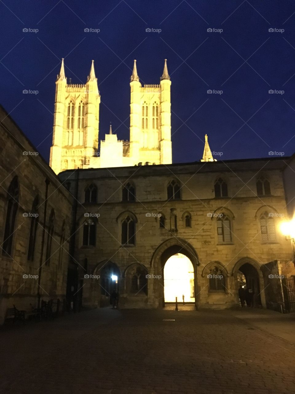 View of Exchequergate in Lincoln with Lincoln Cathedral illuminated at night 