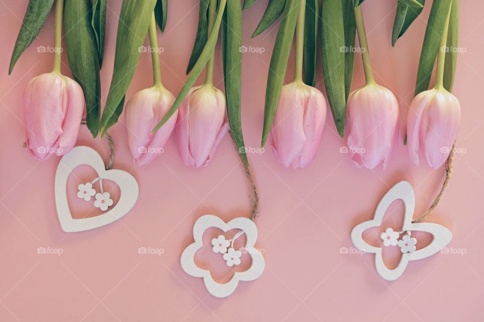 pink tulips with wooden decorations