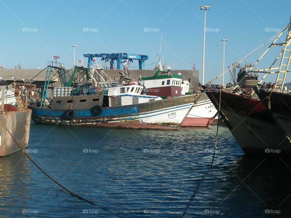 Blue ship in harbour at essaouira city in Morocco.