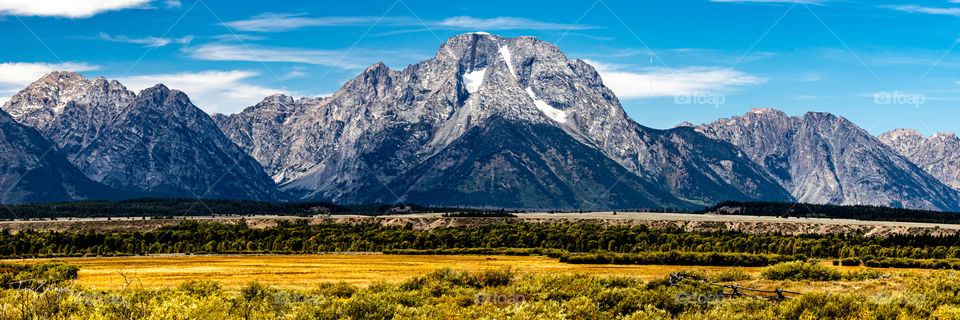 The majestic Grand Tetons holding their last bit of snow in the late summer light. 
