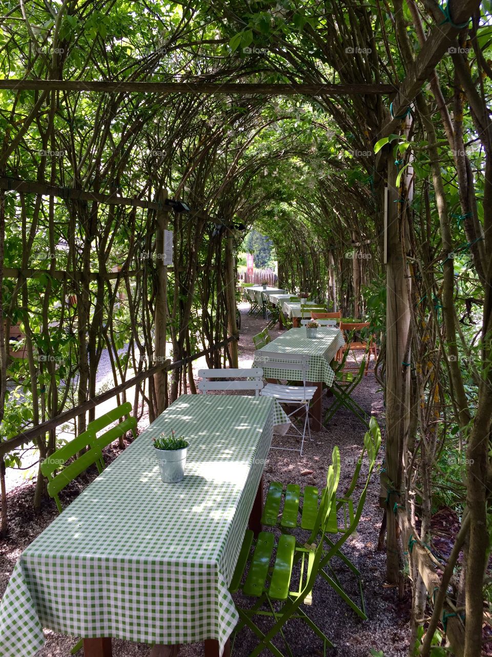 Empty chairs and tables at outdoor restaurant