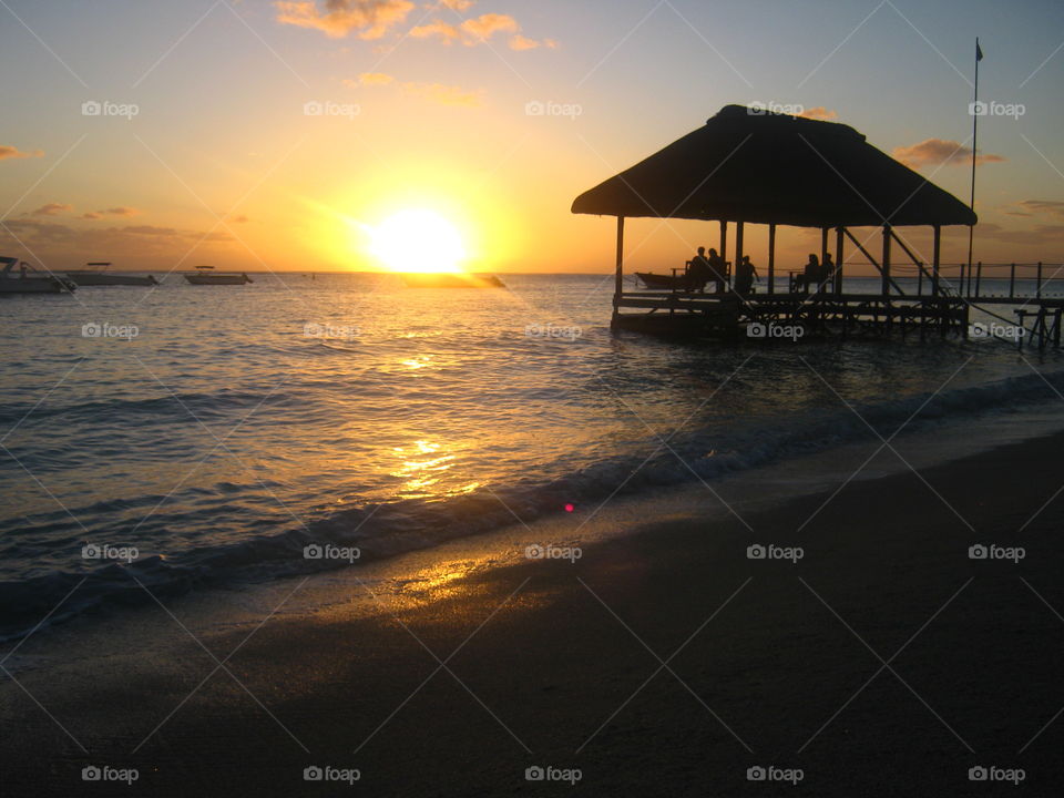 The sun sets on the beach at Sugar beach in Mauritius