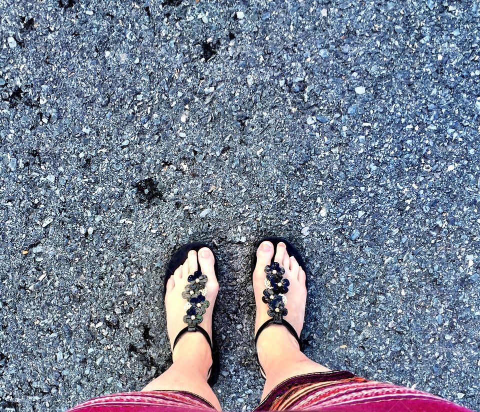 60 year old feet in Vionic Sandals on a gravel pathway! Some rheumatoid arthritis is starting to show  in her toes with some curving noted. Despite this, the feet look happy in these great comfortable shoes!! 