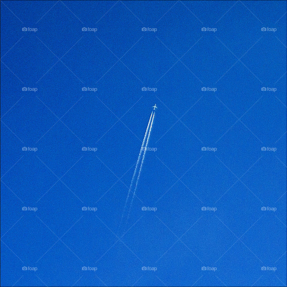 Airliner jet in blue skies