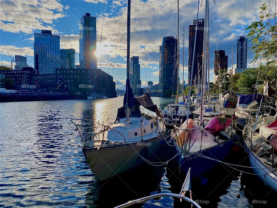 This is beautiful “Newtown Creek” by the “Pulaski Bridge” in LIC, Queens at the golden hour of sunset right before twilight time sets in. The sun’s last dying rays are reflected back by the ocean which intensifies them. 2023. Hypnotic Productions