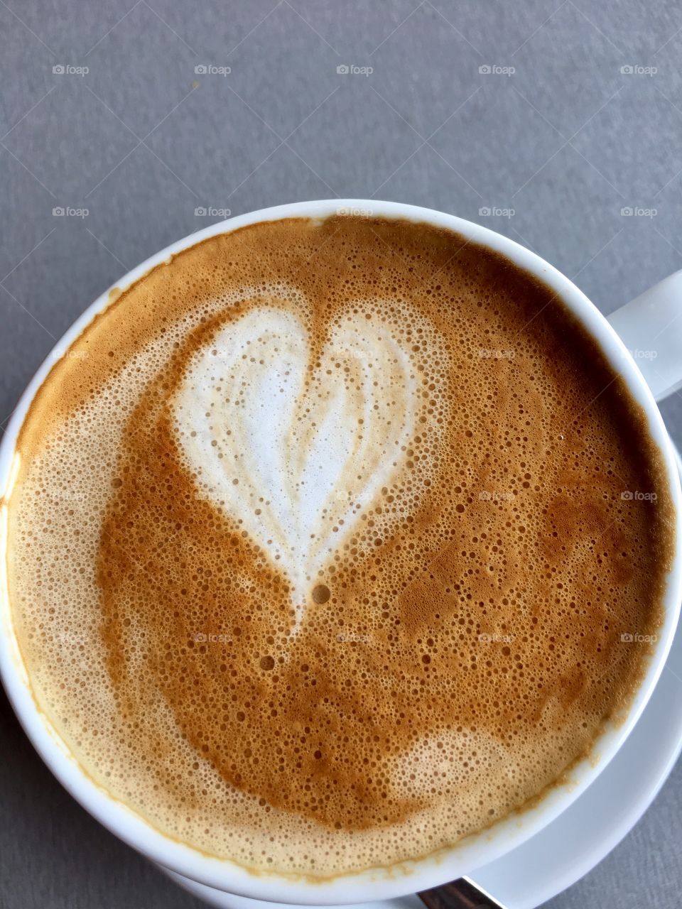 Valentine's Day, heart shape in Cafe latte foam in white coffee cup, love