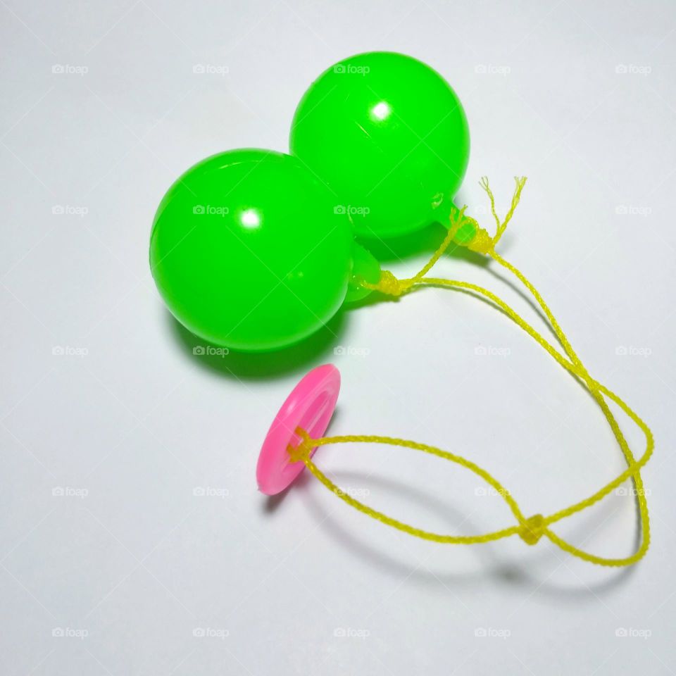 Green toy for children on white background