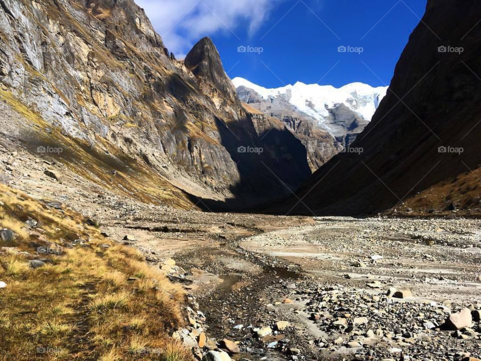 A long hike ahead to reach Japanese Base Camp. We had to climb further up the glacier and cross a river up to our waists. The entire trek that day was about 10 hours. Photo taken on the Dhaulagiri Circuit Trek in Nepal.