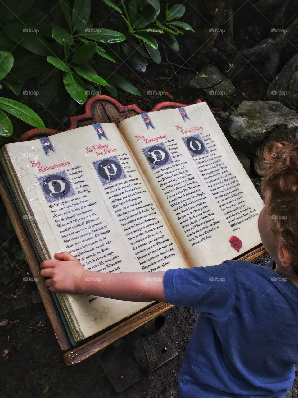 A child is reading an old book