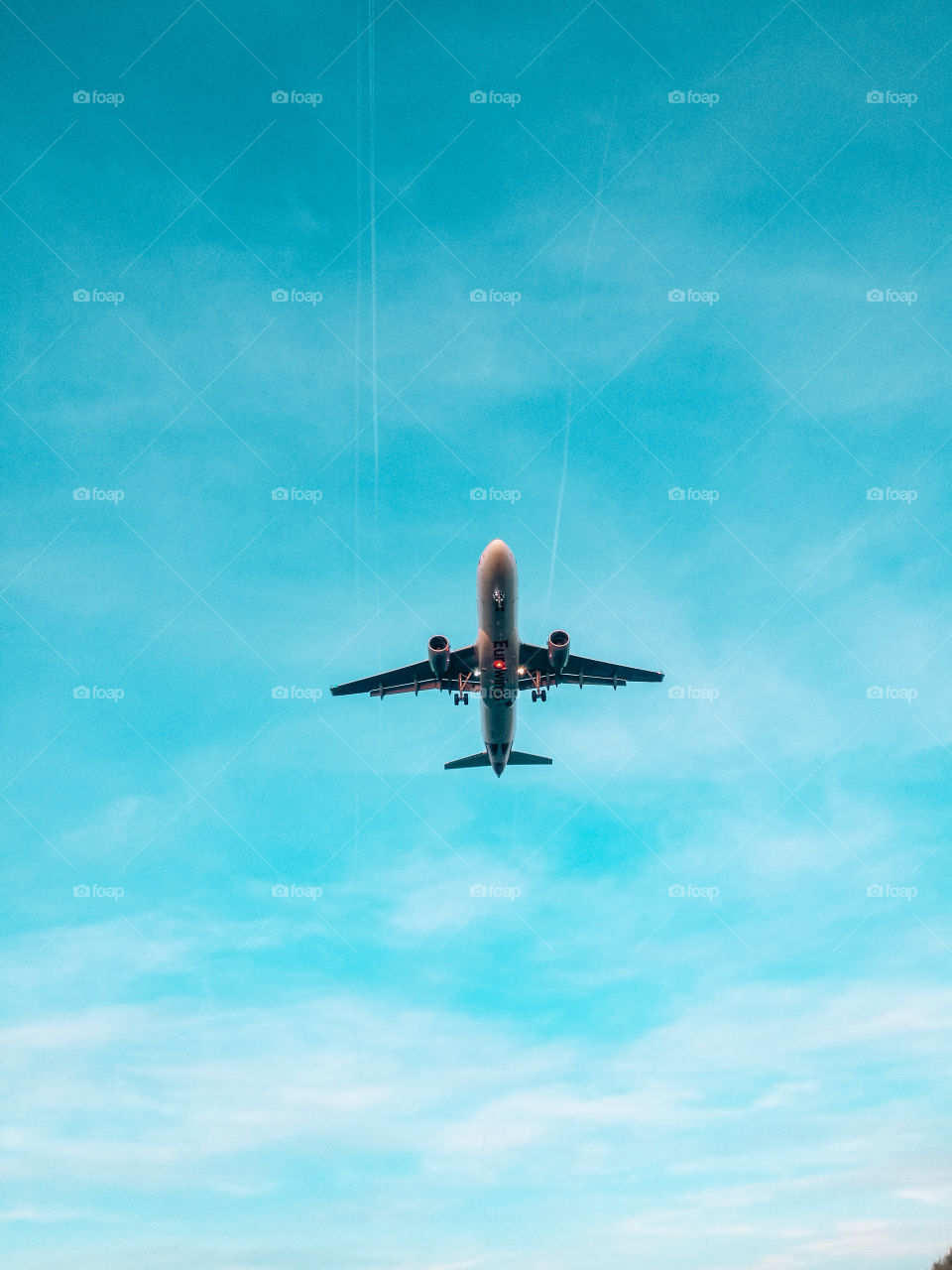 Airplane flying against sky during day 