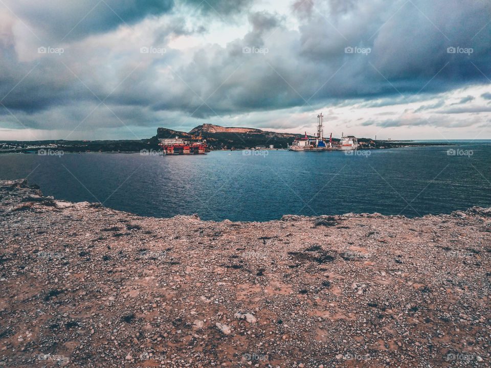 2 big tanker on the shoreline with cloudy weather