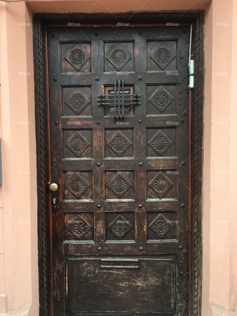 Wooden door with carved design, Bucharest, Romania