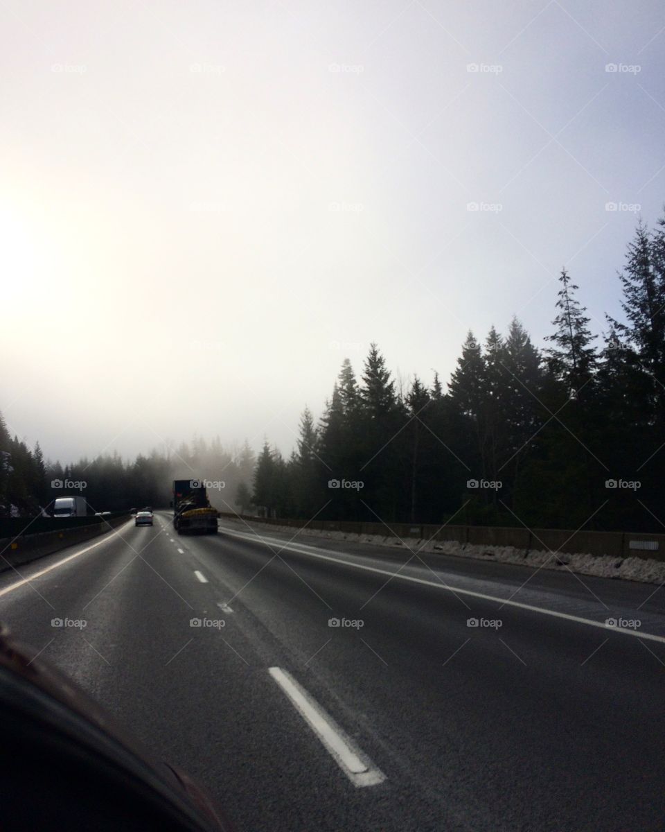 Driving down a foggy pass