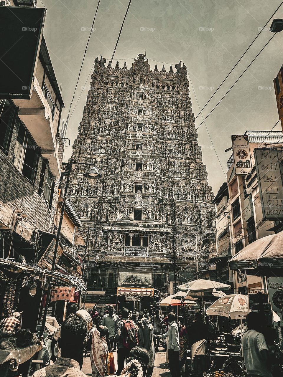 Juxtaposition of old and modern world - Indian street - ancient temple 