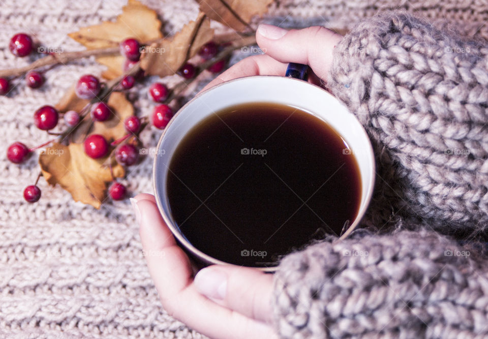 A cup of coffee in hands