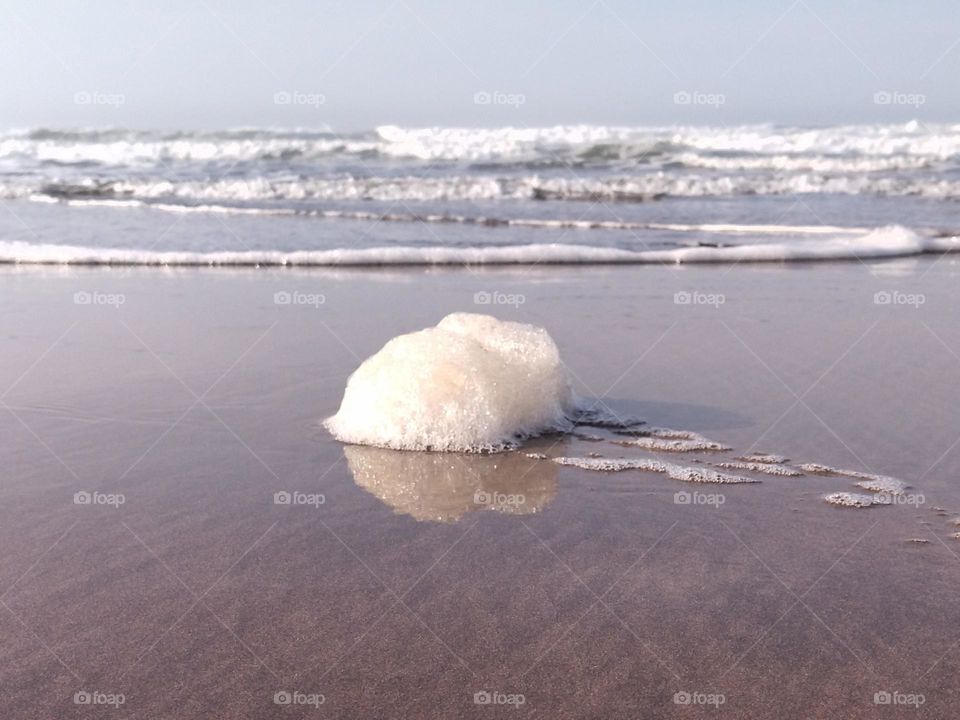 Sea foam and waves