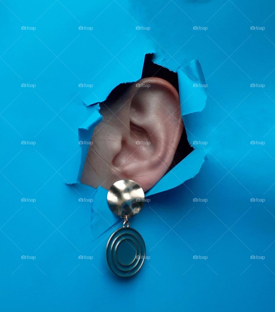 Earrings on a blue background