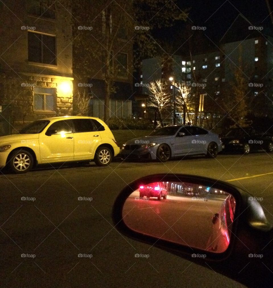 Parked yellow car on street 
