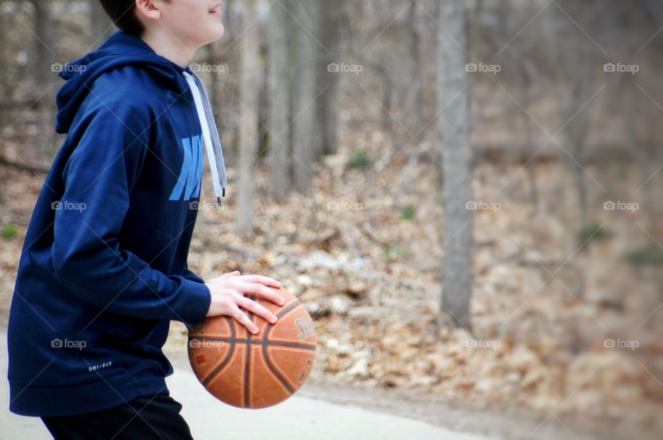 Boy playing Basketball 