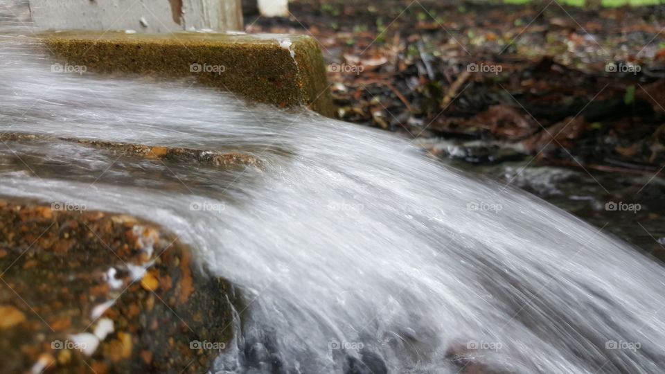 Water from the gutter. Rainy day.