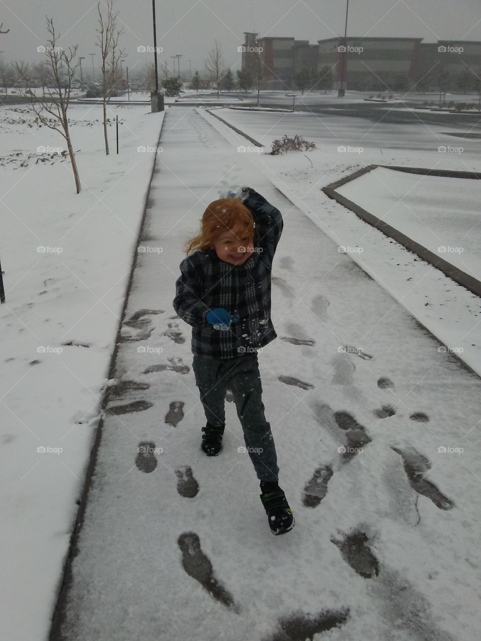 Fun in the snow on a cold and gloomy winter day
