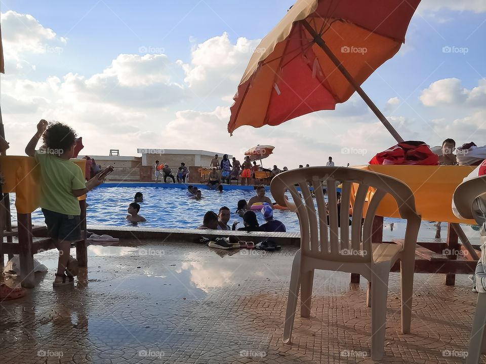 A child looks to the swimmer