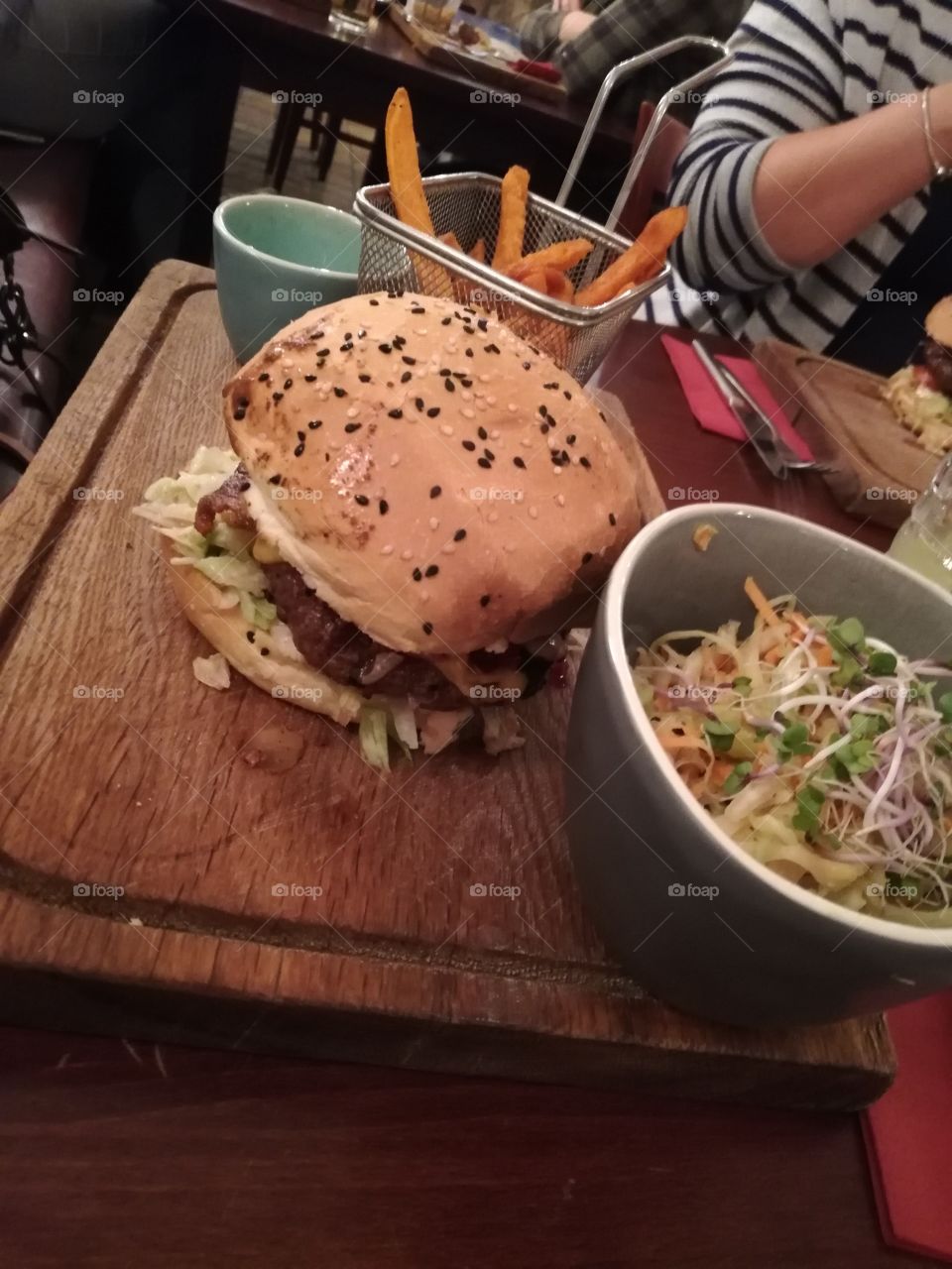Burger and salad with French fries
