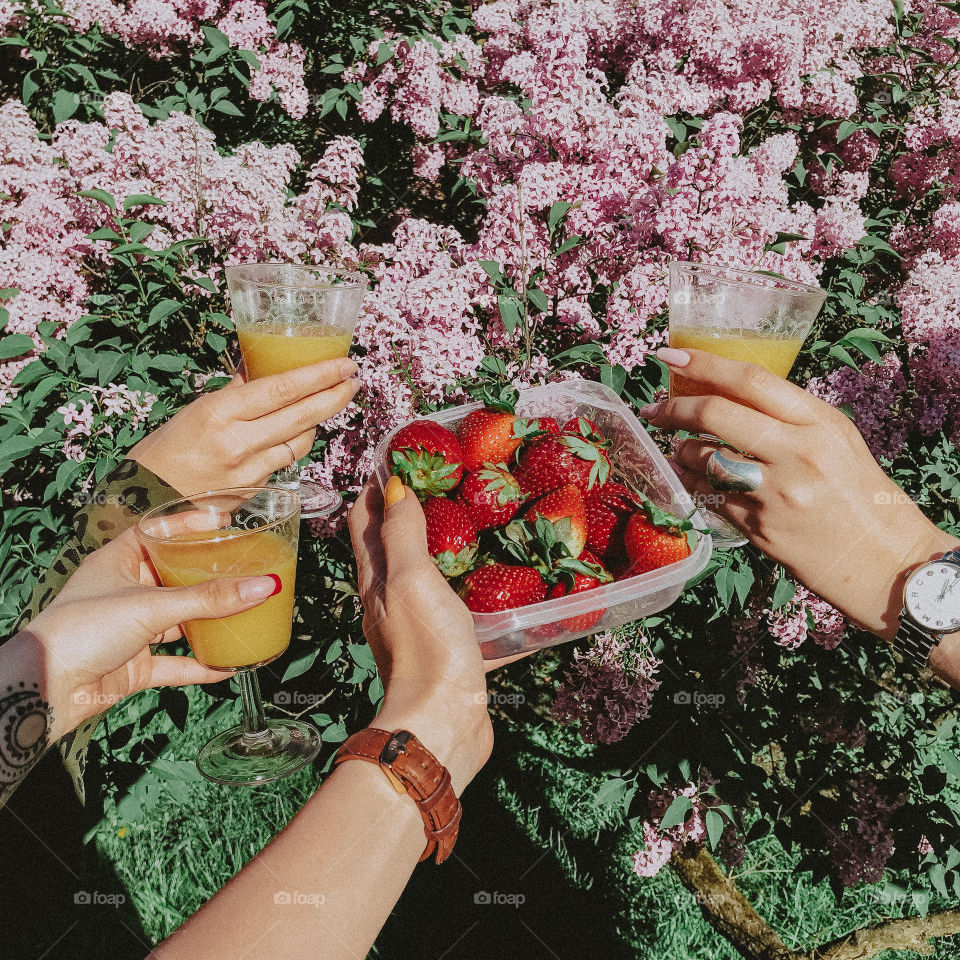 Strawberry, hand and juice 