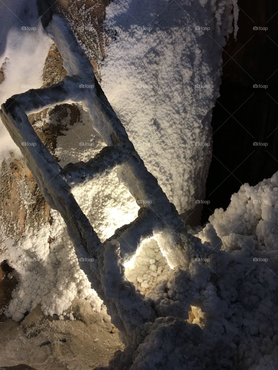 Ladder covered in salt in salt mine 