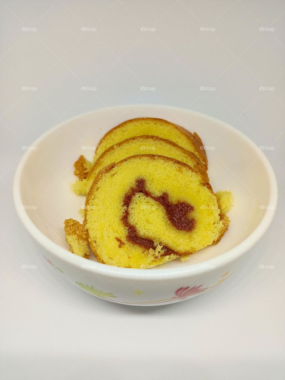 Yellow jam roll cakes isolated set on white background