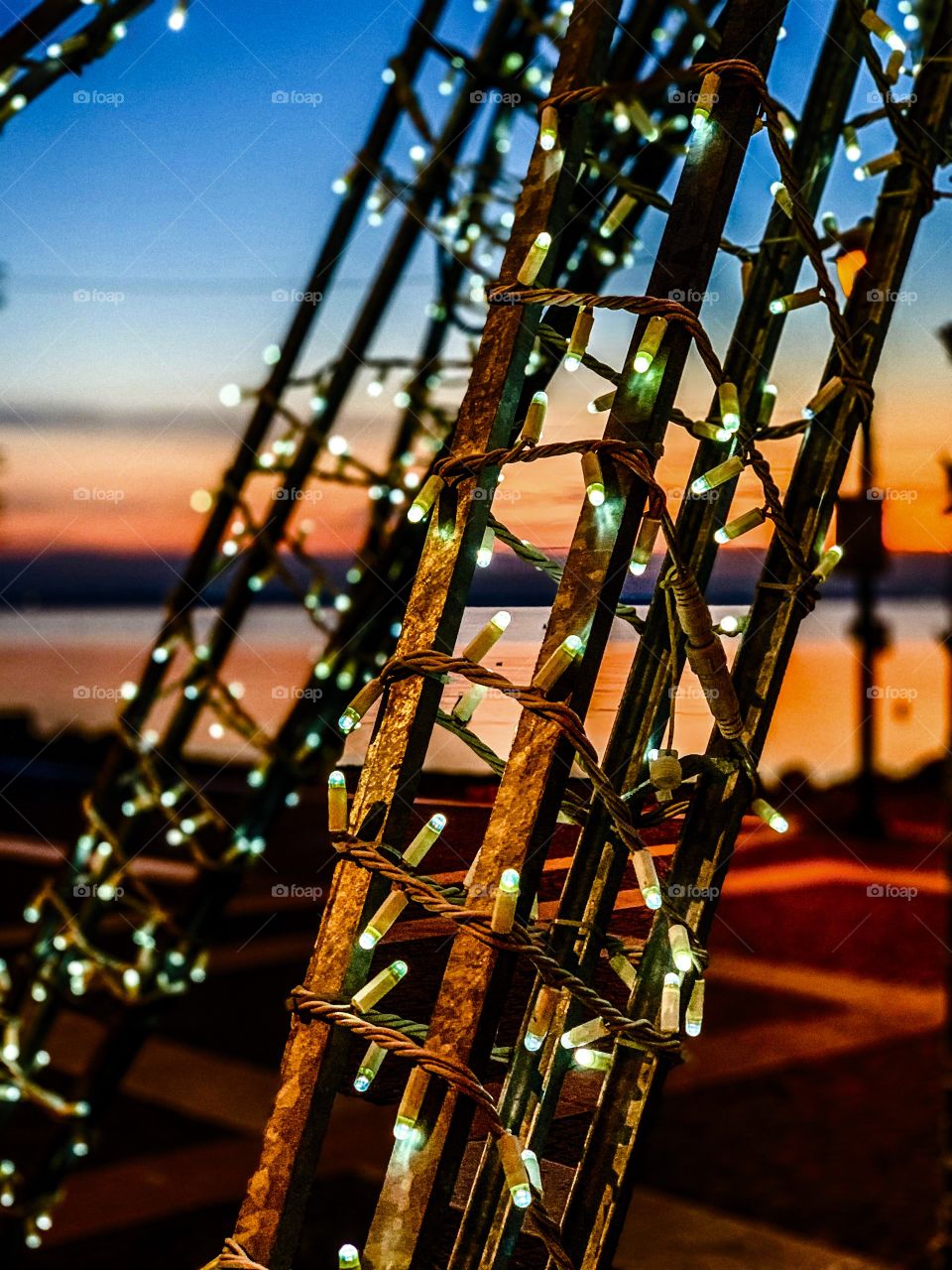 Lights in front of the Garda lake sunset