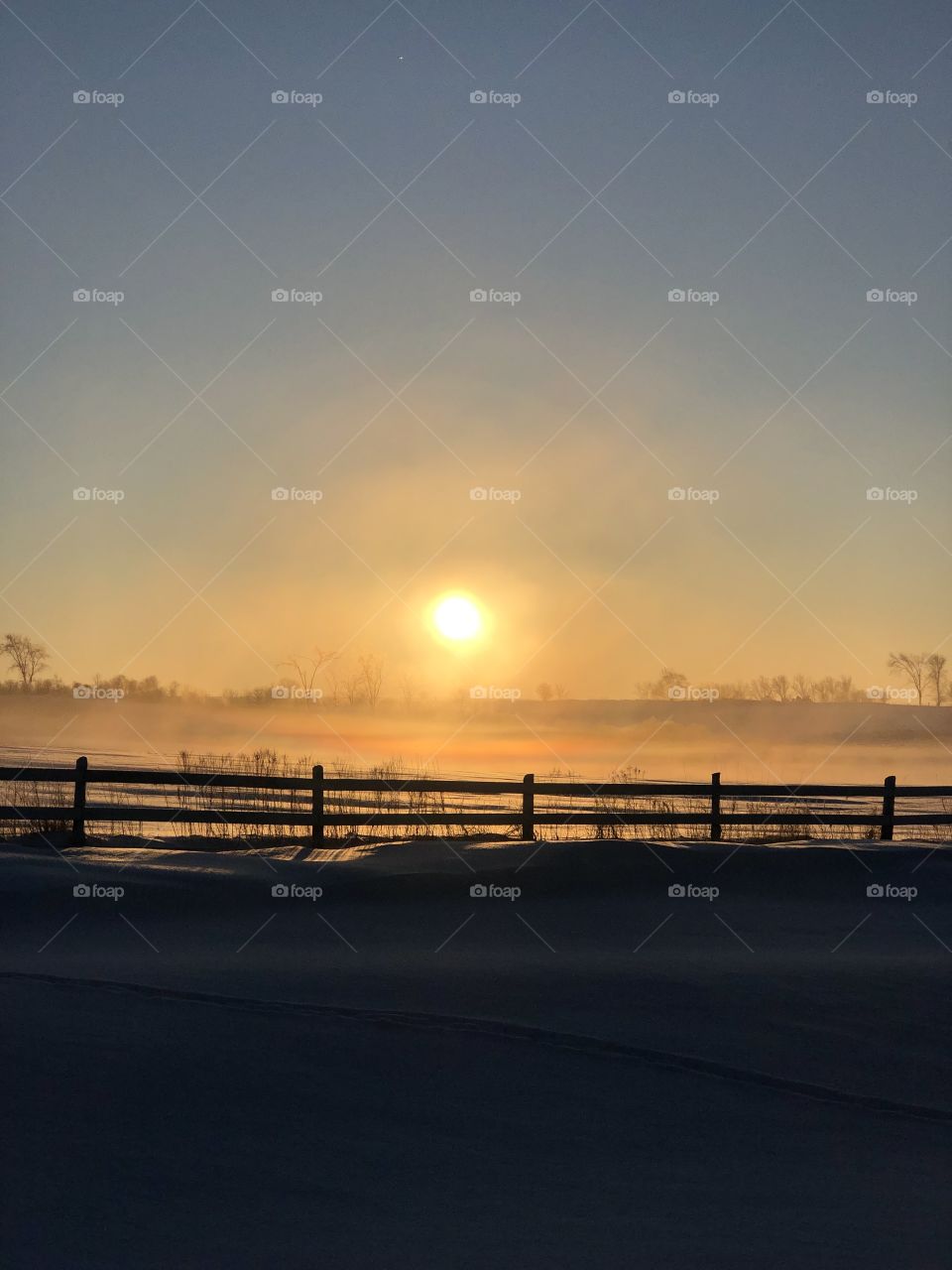 Beautiful sunrise over sleeping fields 