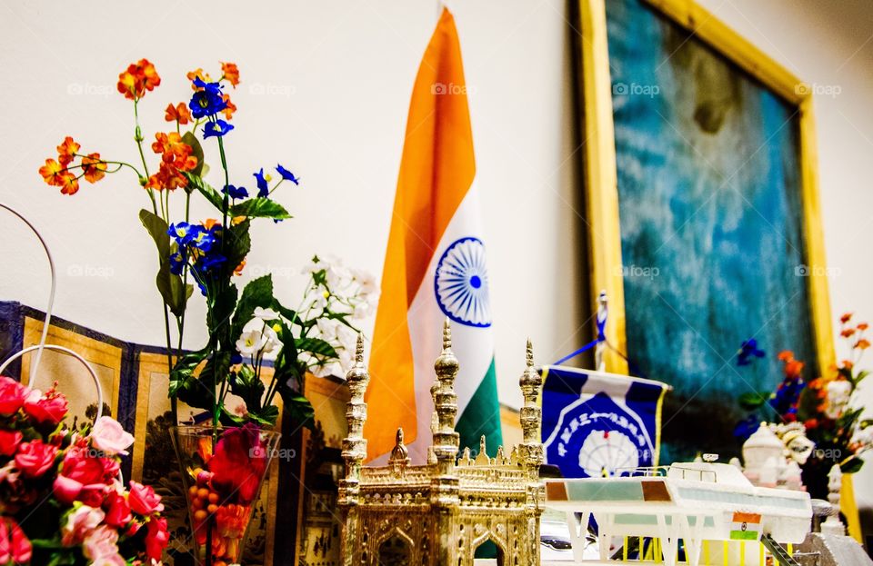 The Indian tricolour.  This picture depicts the Indian flag among many gift articles from different cultures which stands out as an example for unity in diversity .