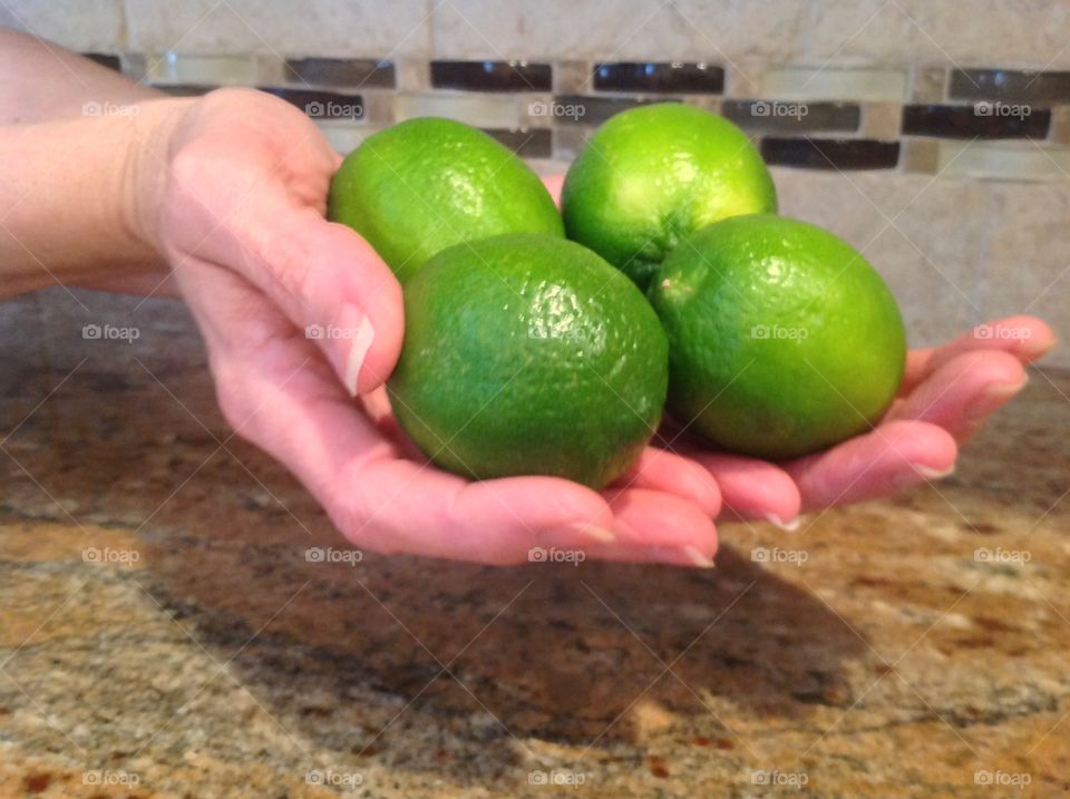 A handful of delicious limes.