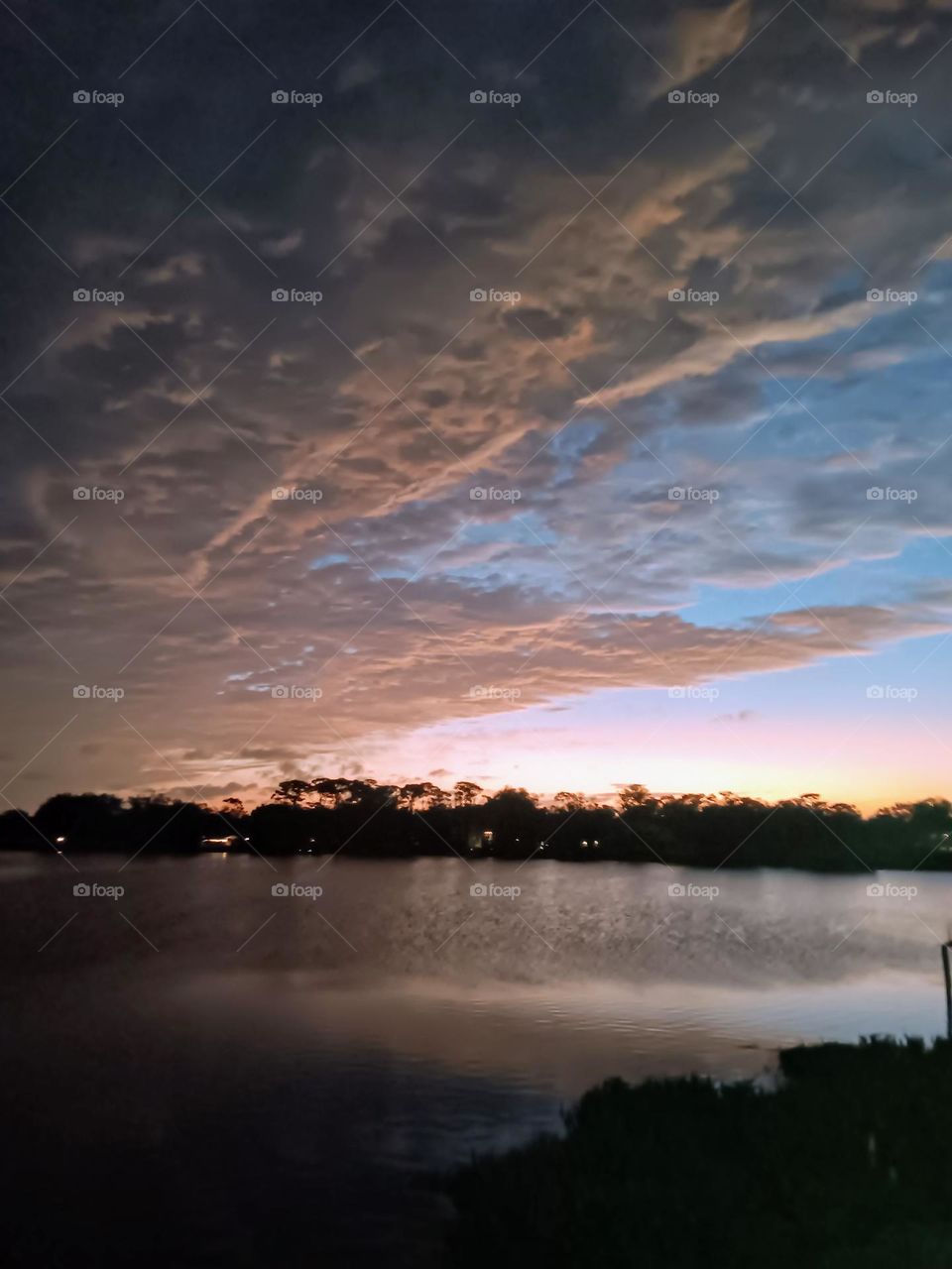 cool sunlit clouds over Lake Fairview,Florida