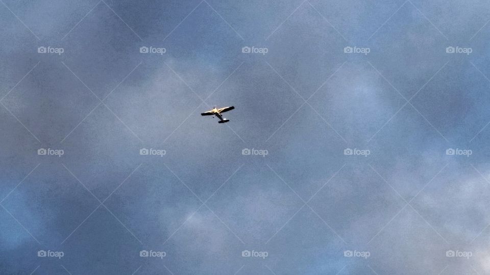 airplane flying in clouds