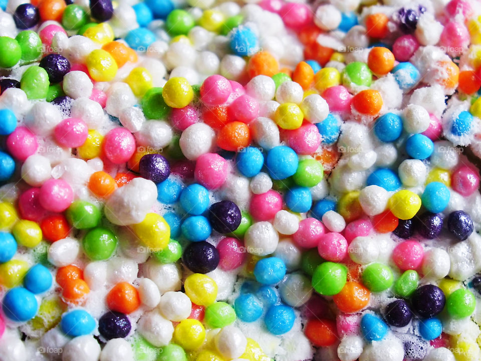 Background made of Colorful round sugar sprinkles 